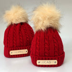 matching red knitted parent and baby hats