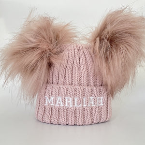 pink knitted pom pom baby hat