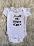 white embroidered baby grow