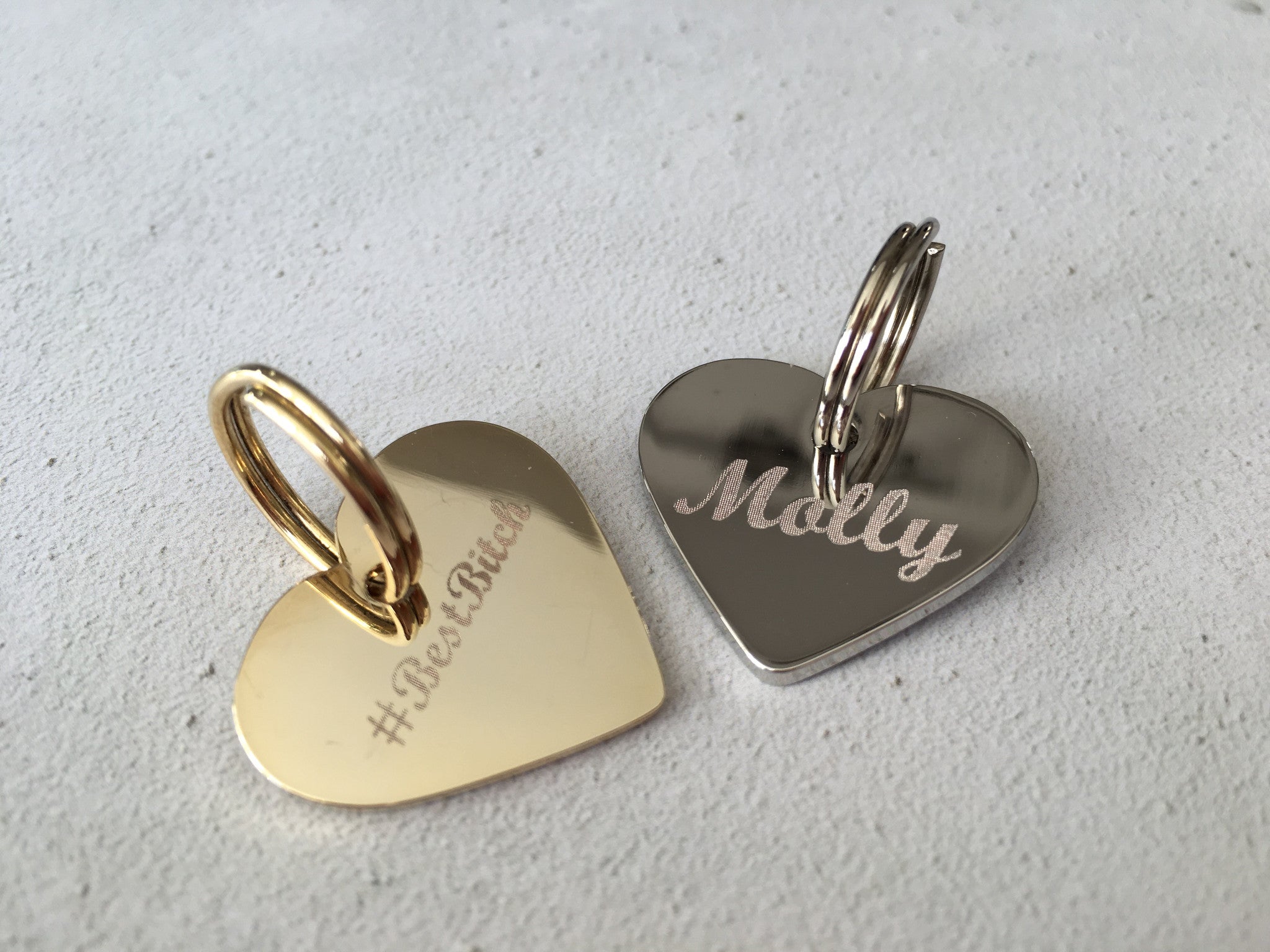 gold and silver heart dog tags