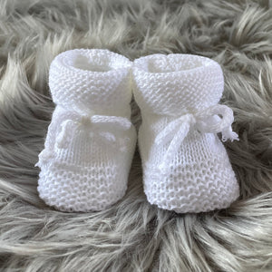 white knitted baby booties