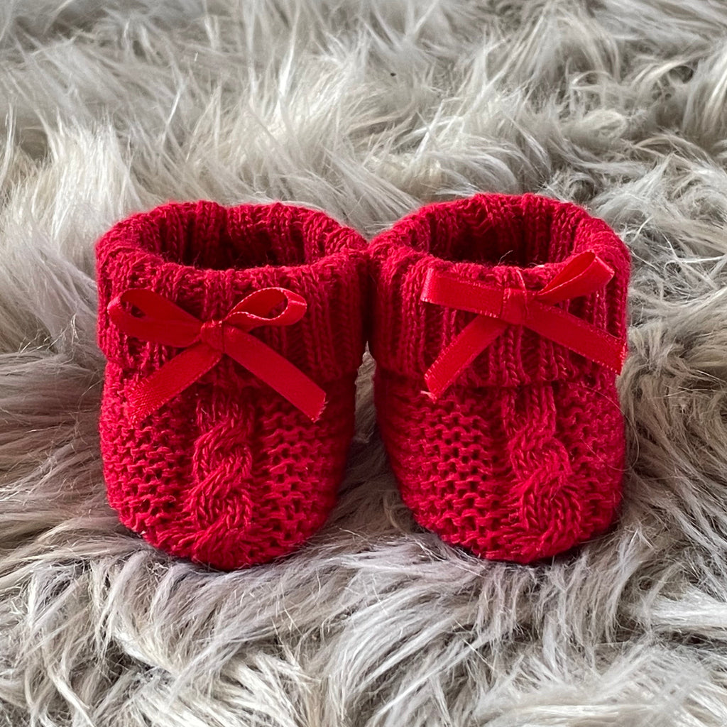 Red knitted baby booties