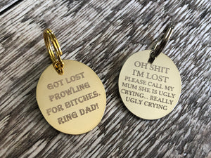 gold and silver oval dog tags