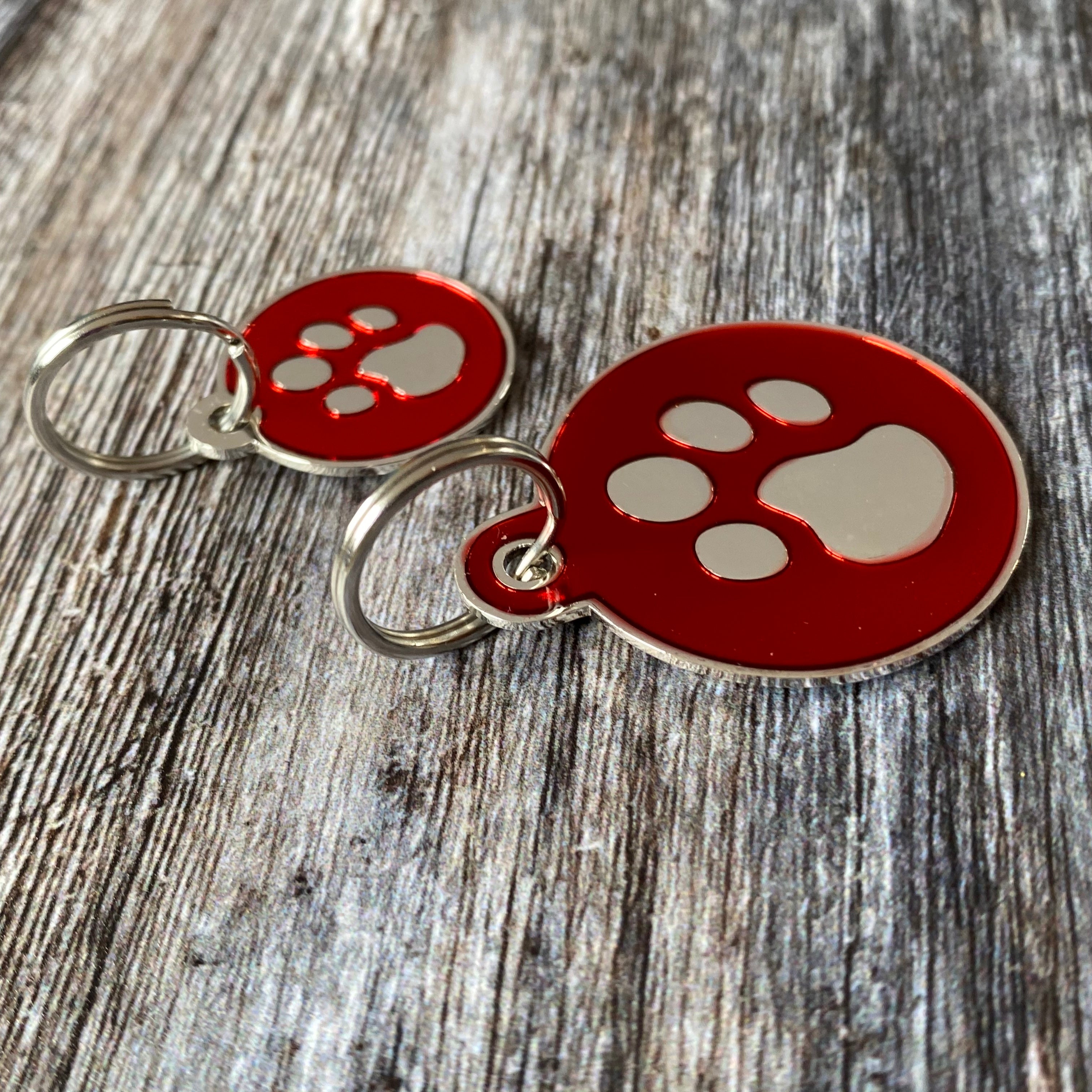 red paw print dog tag