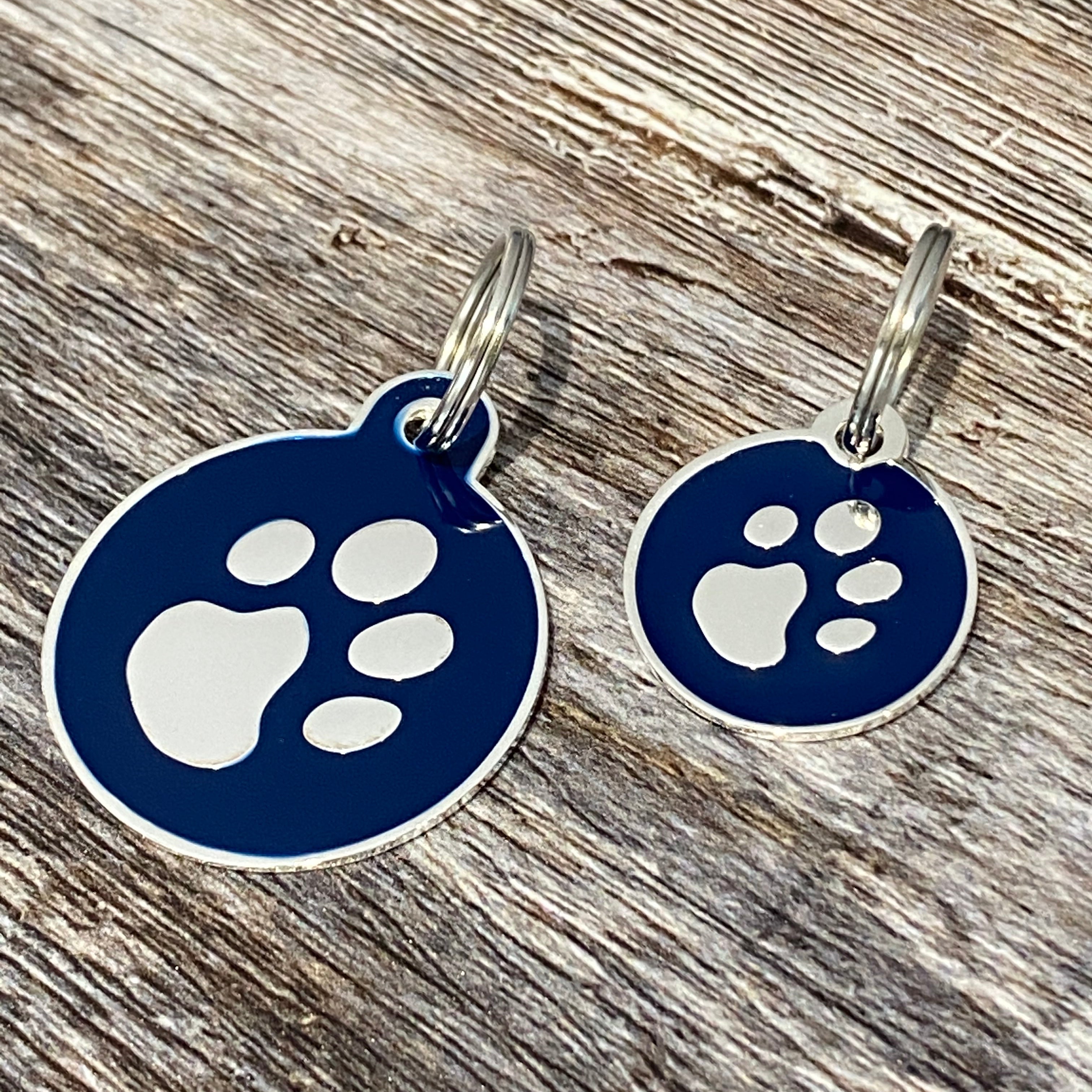 Blue and silver paw print dog tag